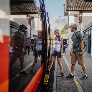 A man and a woman just boarding the train at the station | © Golm Silvretta Lünersee Tourismus GmbH Bregenz, Philipp Schilcher